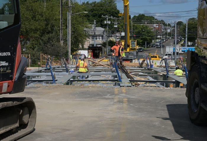 Workers on bridge deck